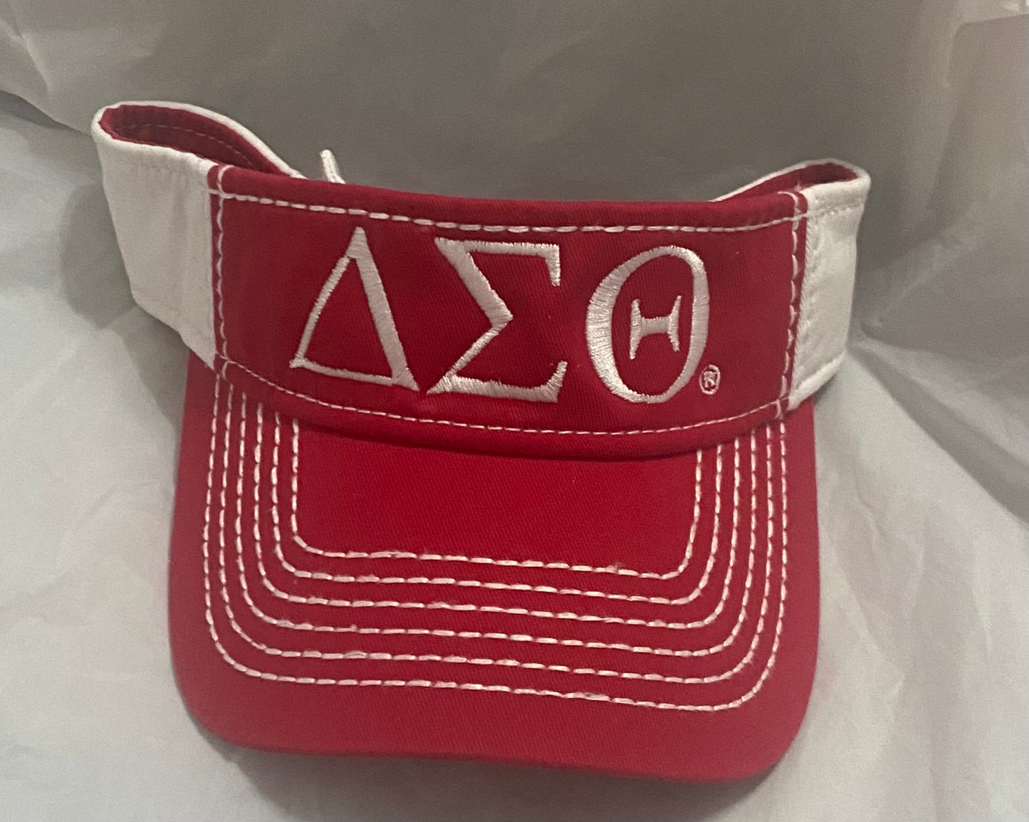 DST-VISOR-RED AND WHITE-WHITE EMBROIDERY DELTA GREEK LETTERS- with adjustable velcro band